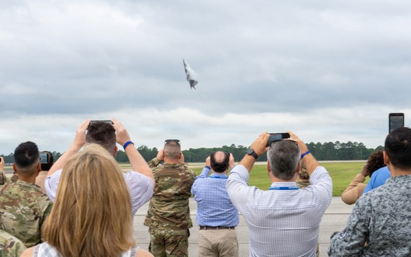 National Security Forum and Gathering of Eagles attendees observe Airpower demonstration at Maxwell Air Force Base