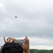 National Security Forum and Gathering of Eagles attendees observe Airpower demonstration at Maxwell Air Force Base