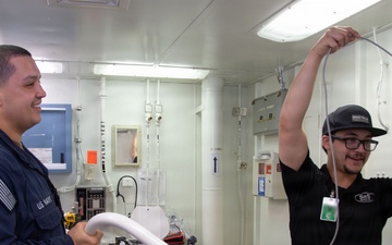 Ronald Reagan Sailors and Contractors Assemble Dental Equipment