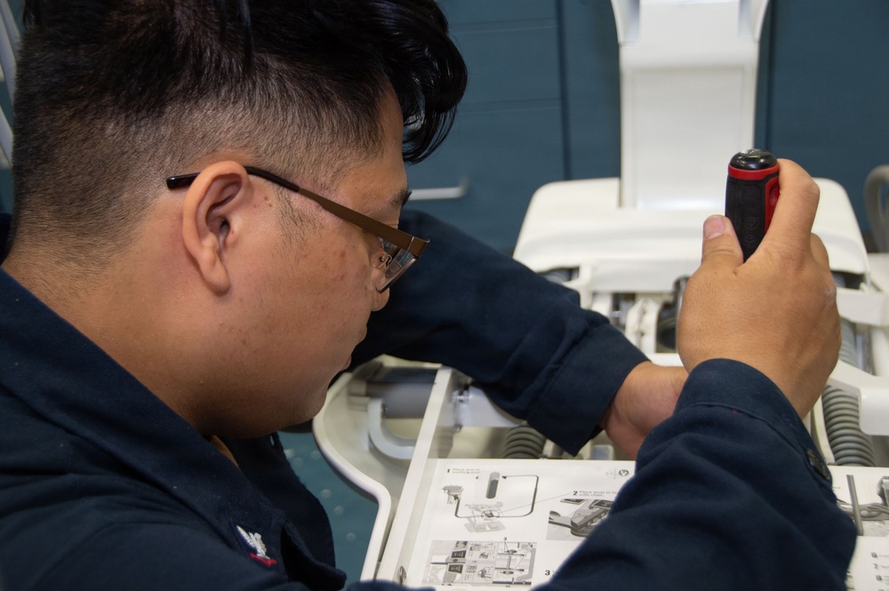 Ronald Reagan Sailors and Contractors Assemble Dental Equipment