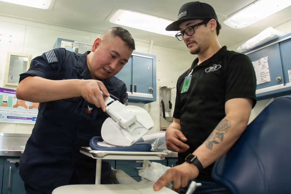 Ronald Reagan Sailors and Contractors Assemble Dental Equipment