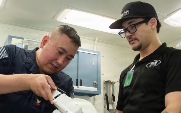 Ronald Reagan Sailors and Contractors Assemble Dental Equipment