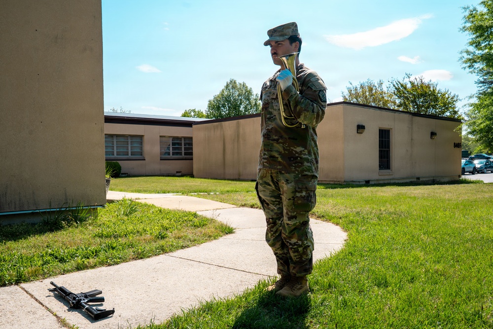 Army Soldier Plays Bugle During Military Ceremony at Installation