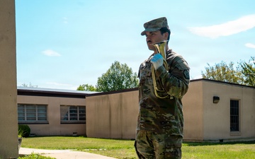 Army Soldier Plays Bugle During Military Ceremony at Installation