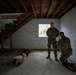 Region II Best Warrior Competitors search a detainee during Range Run