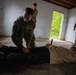 Region II Best Warrior Competitors search a detainee during Range Run