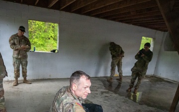 Region II Best Warrior Competitors search a detainee during Range Run