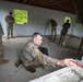 Region II Best Warrior Competitors search a detainee during Range Run