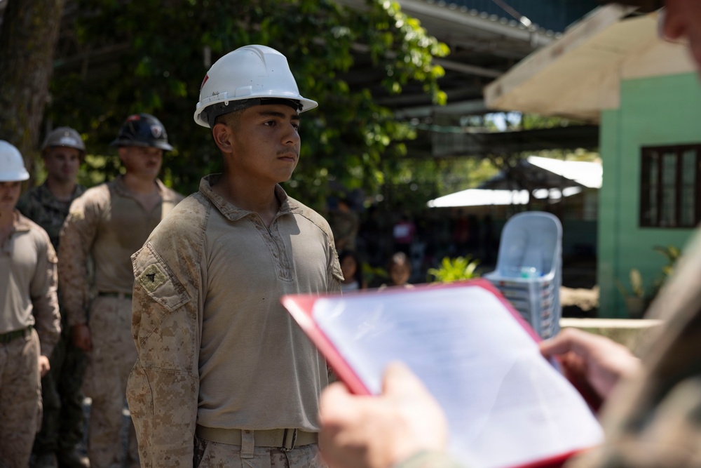 Balikatan 2026: U.S. Marine receives a Navy and Marine Corps Achievement Medal during the construction of a multi-purpose facility