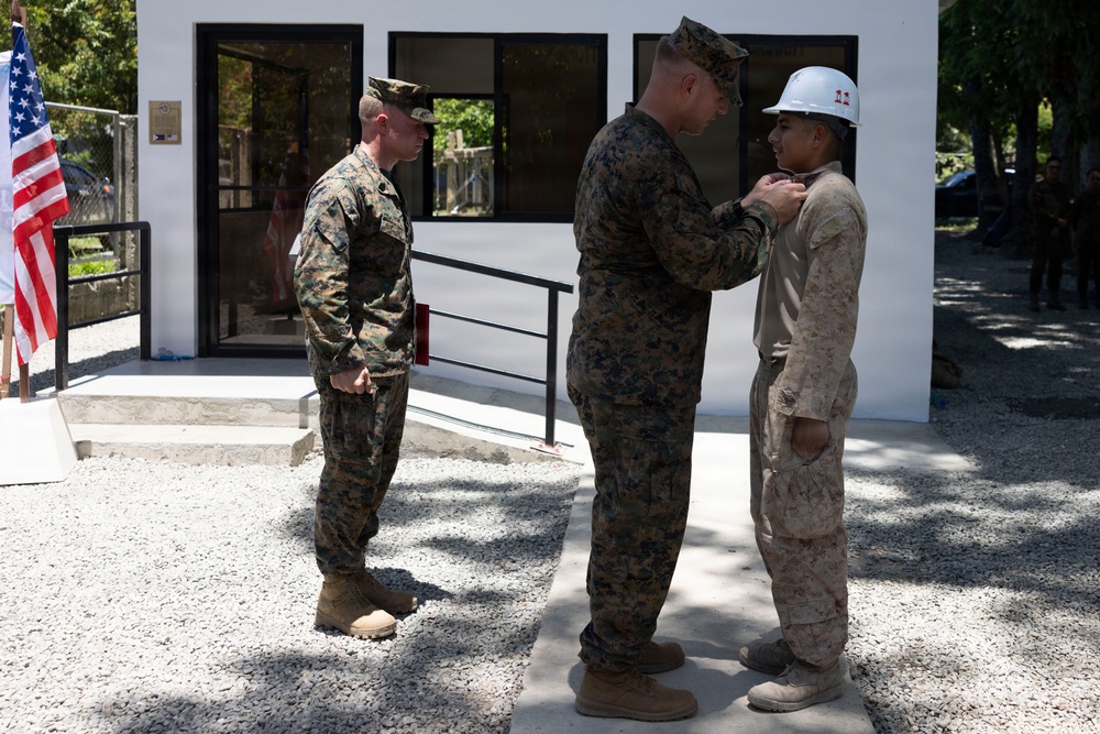 Balikatan 2026: U.S. Marine receives a Navy and Marine Corps Achievement Medal during the construction of a multi-purpose facility