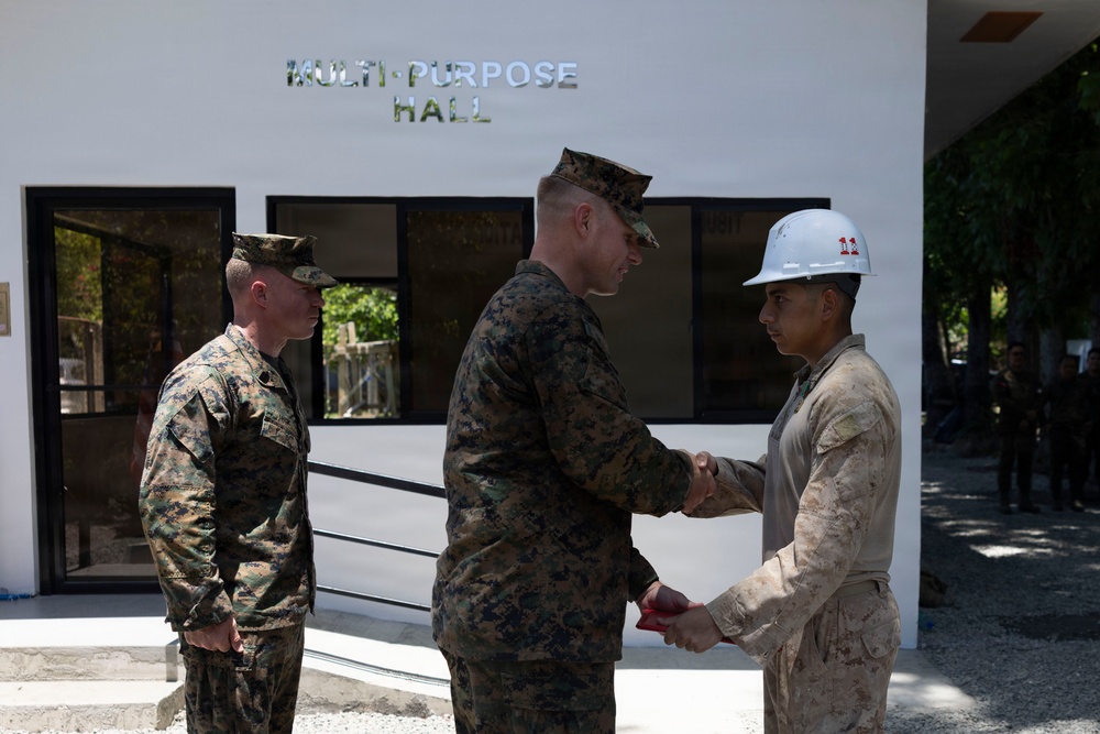 Balikatan 2026: U.S. Marine receives a Navy and Marine Corps Achievement Medal during the construction of a multi-purpose facility