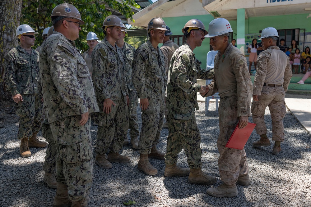 Balikatan 2026: U.S. Marine receives a Navy and Marine Corps Achievement Medal during the construction of a multi-purpose facility