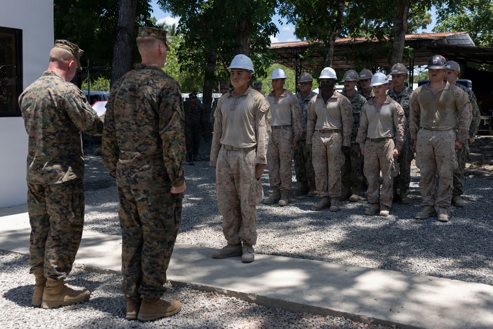 Balikatan 2026: U.S. Marine receives a Navy and Marine Corps Achievement Medal during the construction of a multi-purpose facility