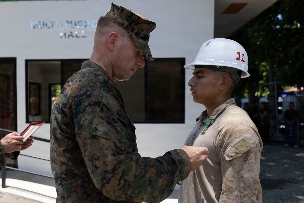 Balikatan 2026: U.S. Marine receives a Navy and Marine Corps Achievement Medal during the construction of a multi-purpose facility