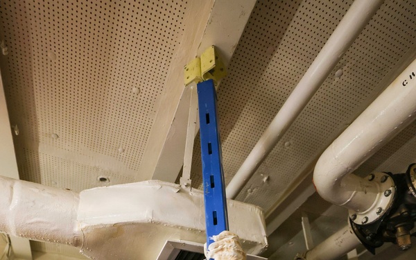 Sailors use metal shoring for damage control drill onboard USS Lake Erie (CG 70)