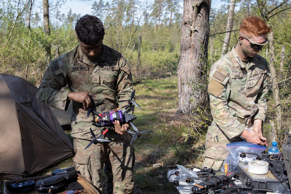 U.S. Soldiers from the 1st Squadron, 2d Cavalry Regiment assemble and tests drones