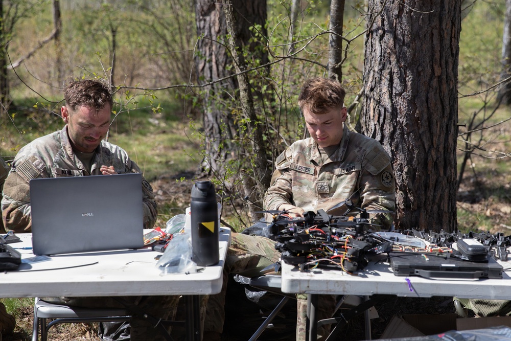 U.S. Soldiers from the 1st Squadron, 2d Cavalry Regiment assemble and tests drones