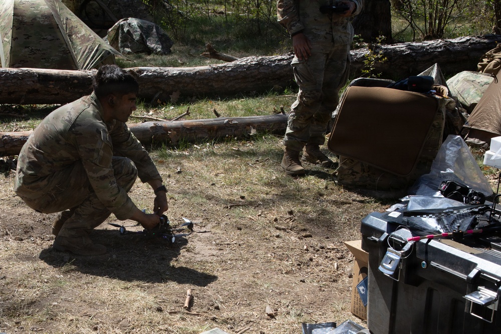 U.S. Soldiers from the 1st Squadron, 2d Cavalry Regiment assemble and tests drones