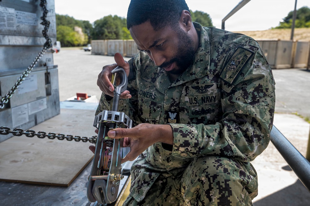 Airmen, Sailors strengthen interoperability during munitions pallet build