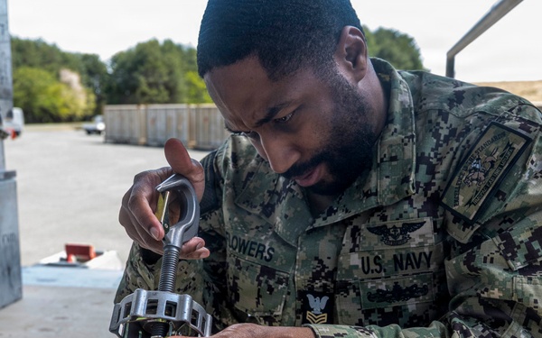 Airmen, Sailors strengthen interoperability during munitions pallet build