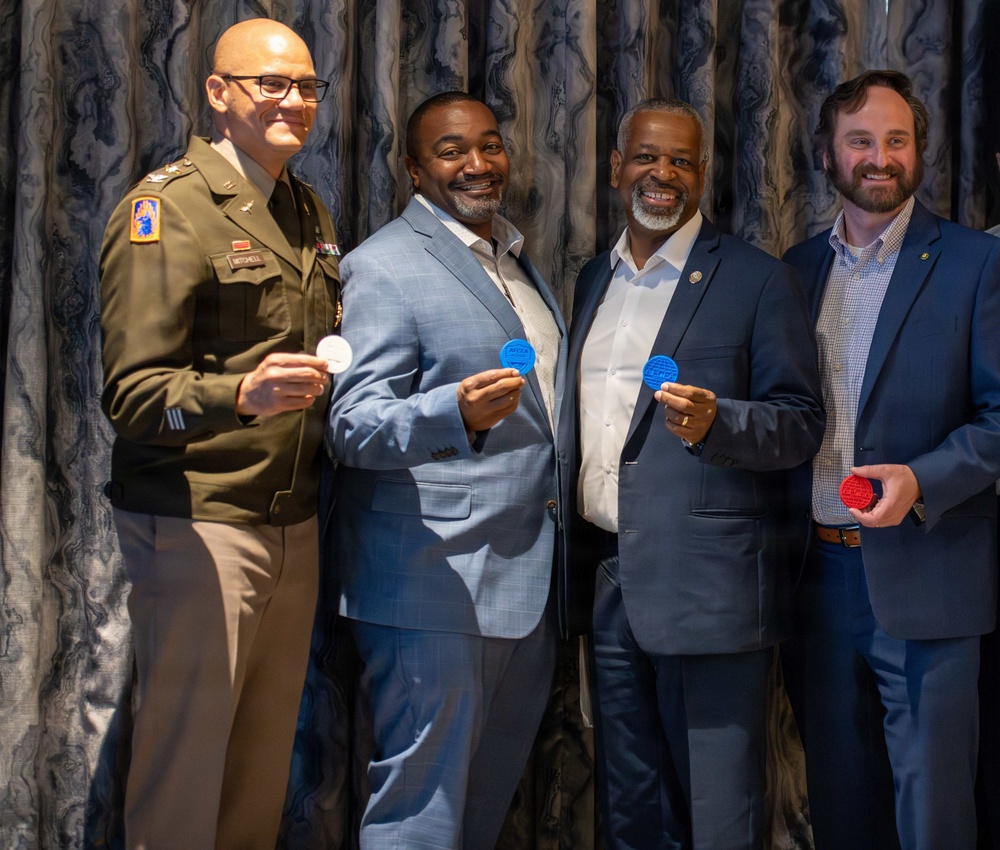 O6 Panel Receives Challenge Coins