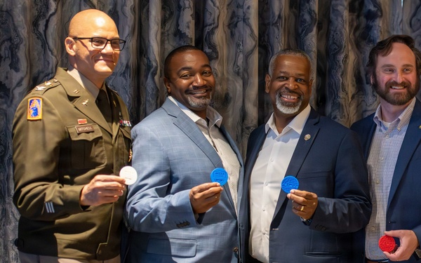 O6 Panel Receives Challenge Coins