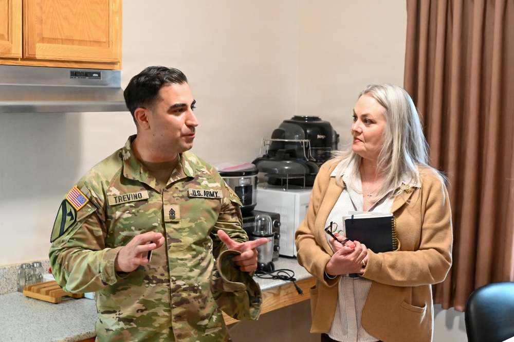 Senior leader spouses tour Fort Leavenworth Single Soldier Quarters and historic home