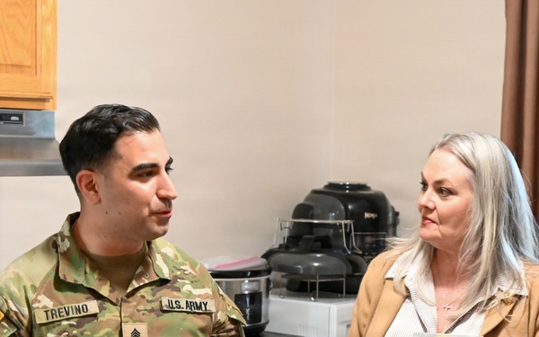 Senior leader spouses tour Fort Leavenworth Single Soldier Quarters and historic home