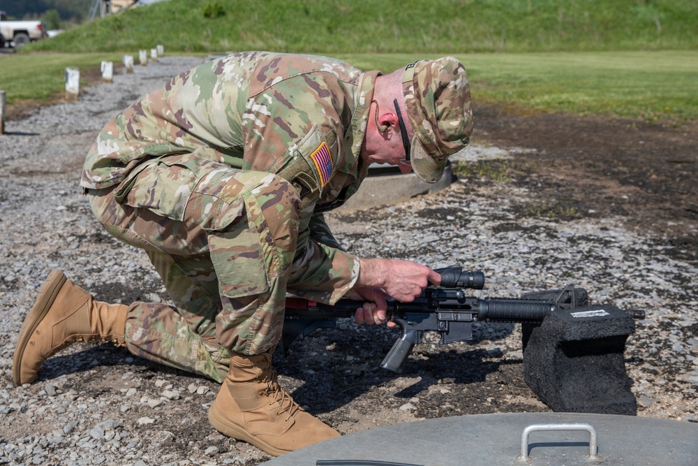 Soldier Adjusts Weapon