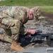 Soldier Adjusts Weapon