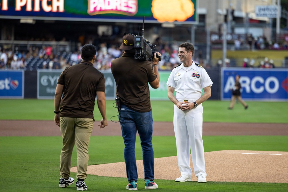 Commanding Officer of Naval Base Coronado throws first pitch during NASCAR day at Petco Park