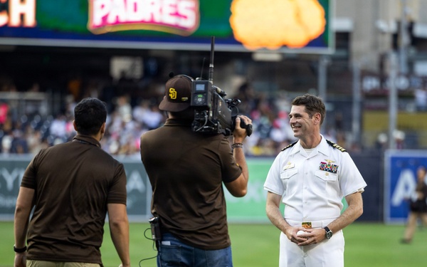Commanding Officer of Naval Base Coronado throws first pitch during NASCAR day at Petco Park
