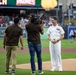 Commanding Officer of Naval Base Coronado throws first pitch during NASCAR day at Petco Park