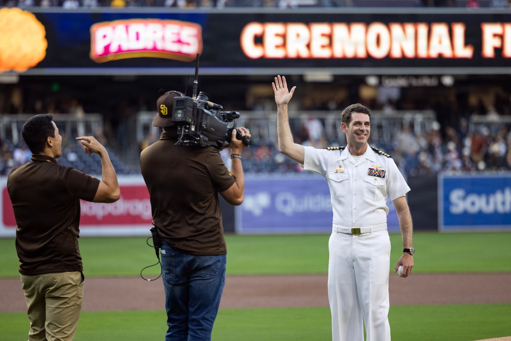 Commanding Officer of Naval Base Coronado throws first pitch during NASCAR day at Petco Park