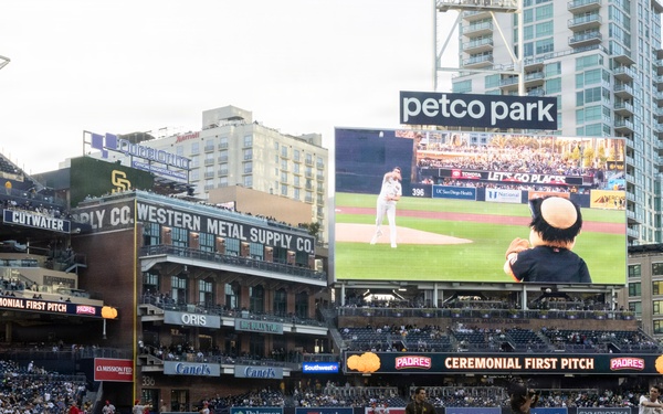 Commanding Officer of Naval Base Coronado throws first pitch during NASCAR day at Petco Park