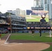 Commanding Officer of Naval Base Coronado throws first pitch during NASCAR day at Petco Park