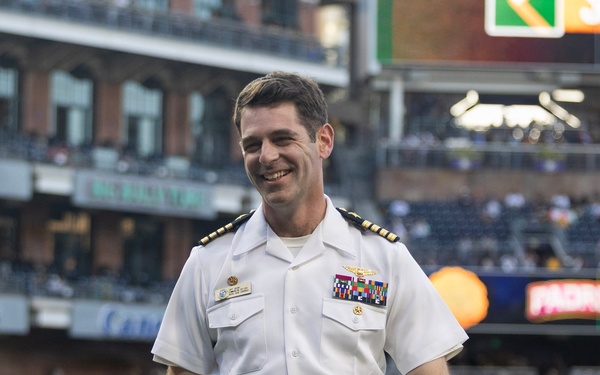Commanding Officer of Naval Base Coronado throws first pitch during NASCAR day at Petco Park