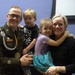 Army Staff Sergeant 1 Crum poses with family following awards ceremony