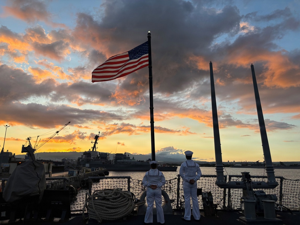 USS HOPPER sailors observe evening colors overlooking USS Arizona Memorial at Joint Base Pearl Harbor, Hawaii
