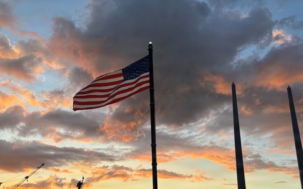 USS HOPPER sailors observe evening colors overlooking USS Arizona Memorial at Joint Base Pearl Harbor, Hawaii