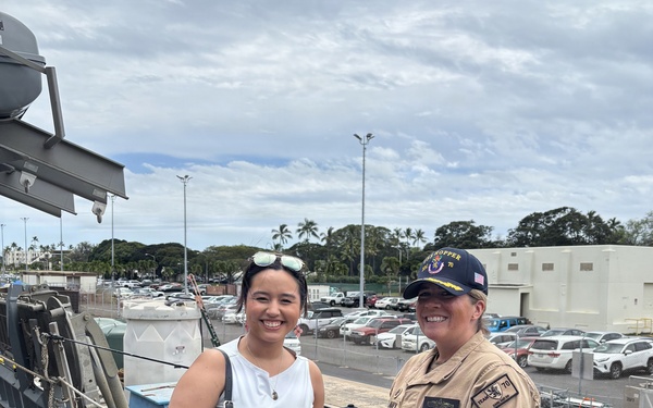 USS Hopper Sailor Presents Ship's Ball Cap to Civilian Visitor at Pearl Harbor