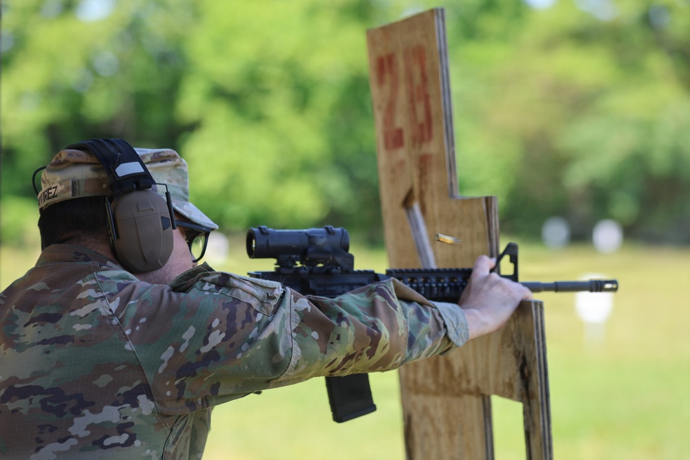 Soldier fires M4 carbine during Promotion Ceremony