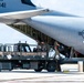 NMCB 1 Sailors and U.S. Airmen load wood cargo for roof restoration operations