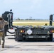 NMCB 1 Sailors and U.S. Airmen load wood cargo for roof restoration operations