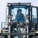 NMCB 1 Sailors and U.S. Airmen load wood cargo for roof restoration operations