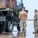 NMCB 1 Sailors and U.S. Airmen load wood cargo for roof restoration operations