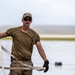 NMCB 1 Sailors and U.S. Airmen load wood cargo for roof restoration operations