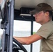 NMCB 1 Sailors and U.S. Airmen load wood cargo for roof restoration operations