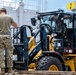 NMCB 1 Sailors and U.S. Airmen load wood cargo for roof restoration operations