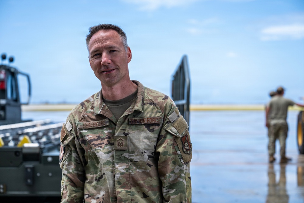 NMCB 1 Sailors and U.S. Airmen load wood cargo for roof restoration operations
